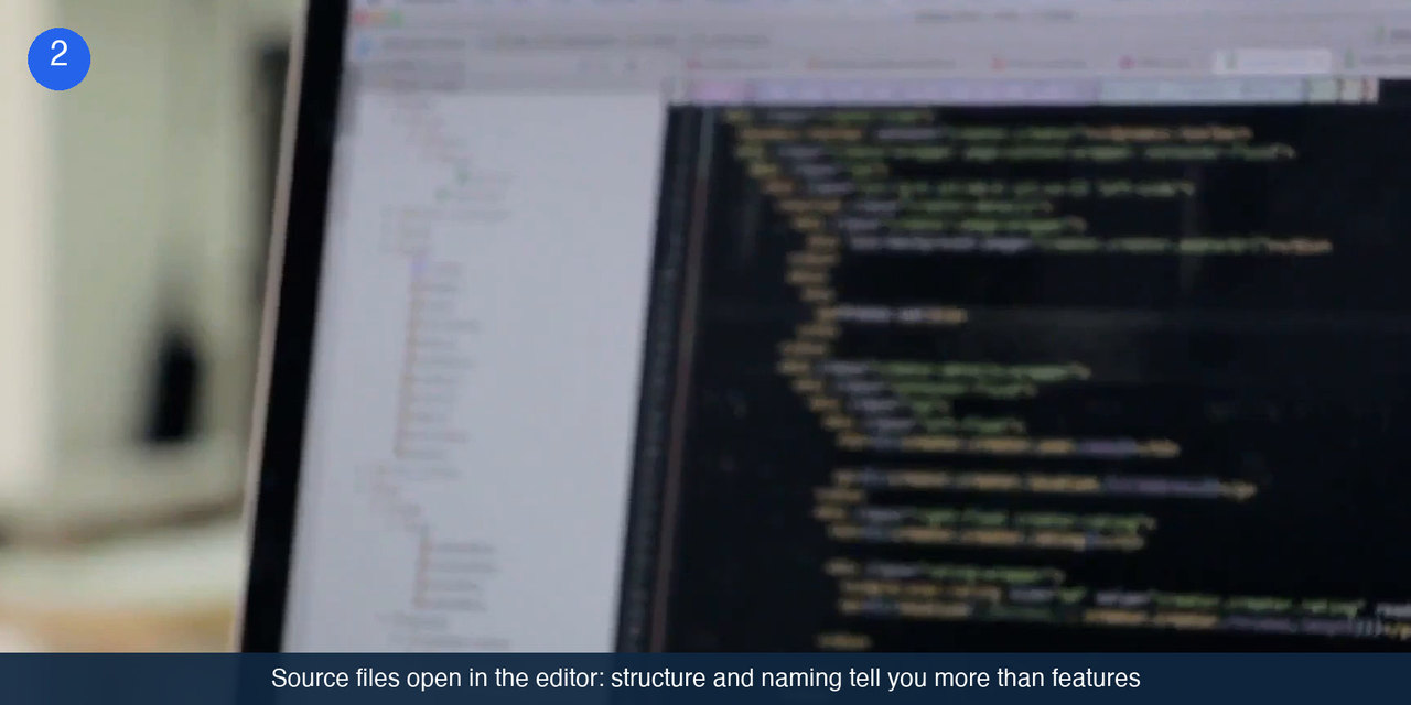 A laptop screen showing a code editor with a file tree on the left and syntax-highlighted source on the right.
